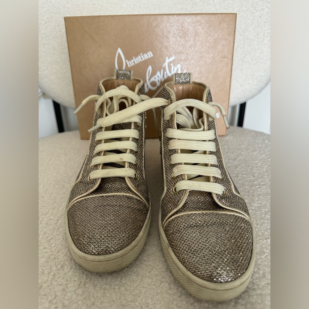Gold Louboutin high top sneakers